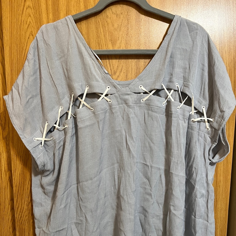 NWT. Light blue comfy blouse. Size 3XL.